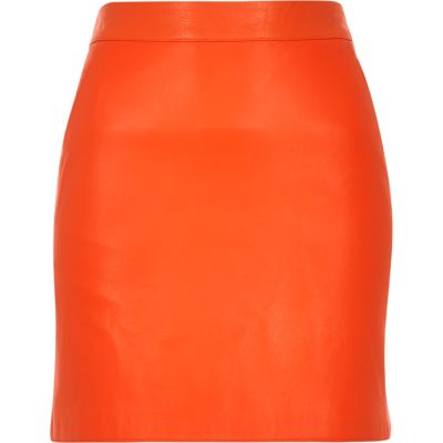 Orange leather-look mini skirt